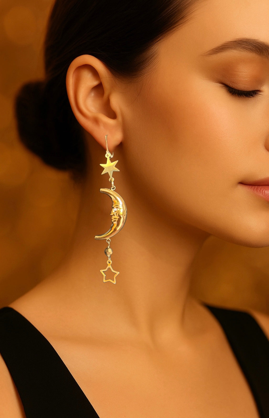 Mono orecchino in acciaio dorato