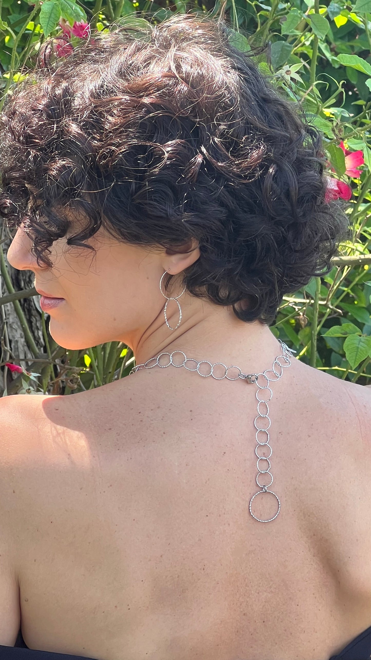 Mono orecchino e collana in acciaio