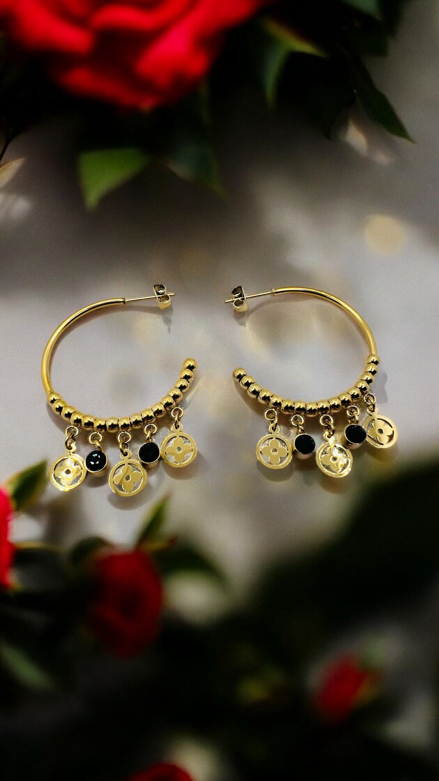 Orecchini in acciaio dorato con pendenti