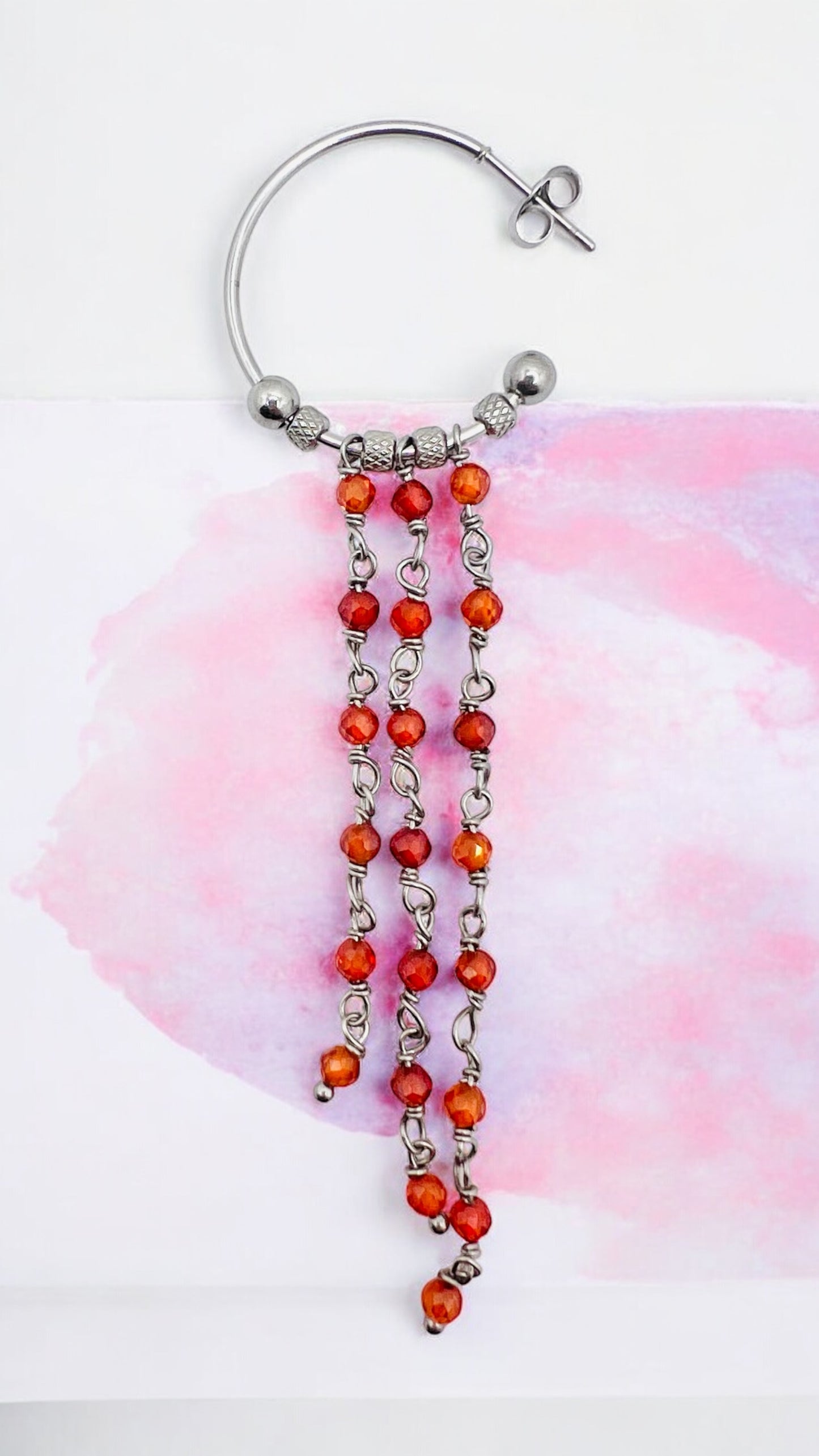 Orecchini in acciaio e zirconi arancioni