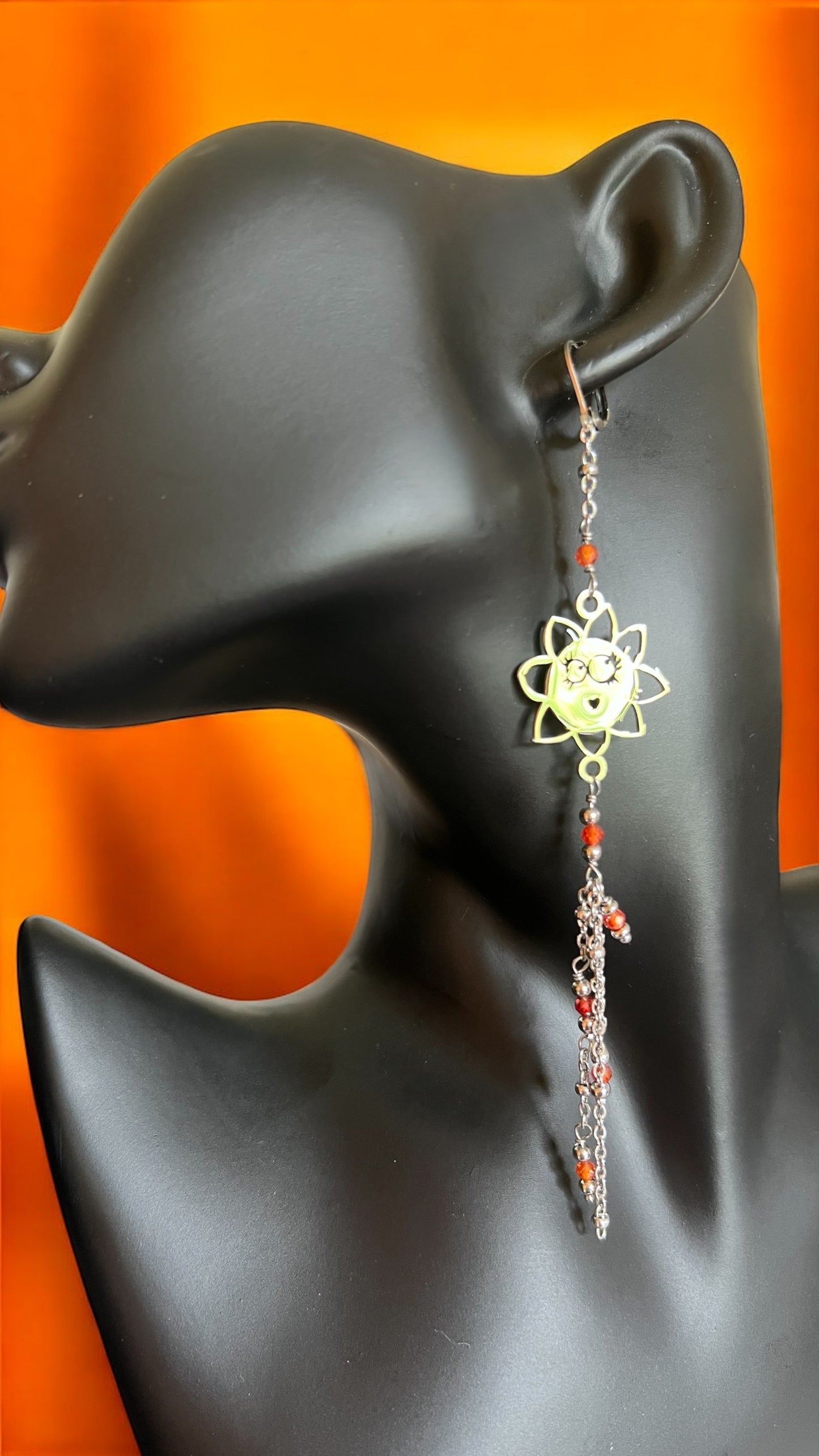 Mono orecchino in acciaio e zirconi arancioni