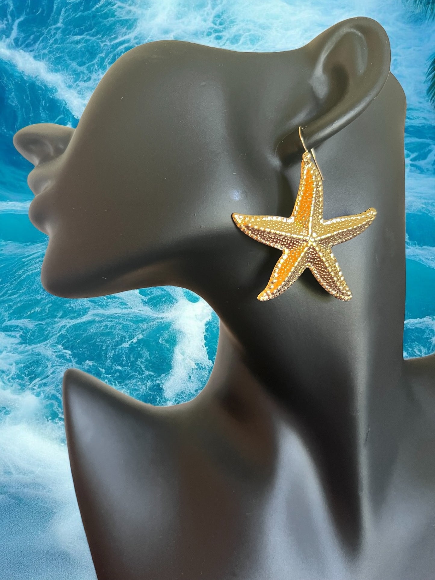 Mono orecchino in acciaio dorato