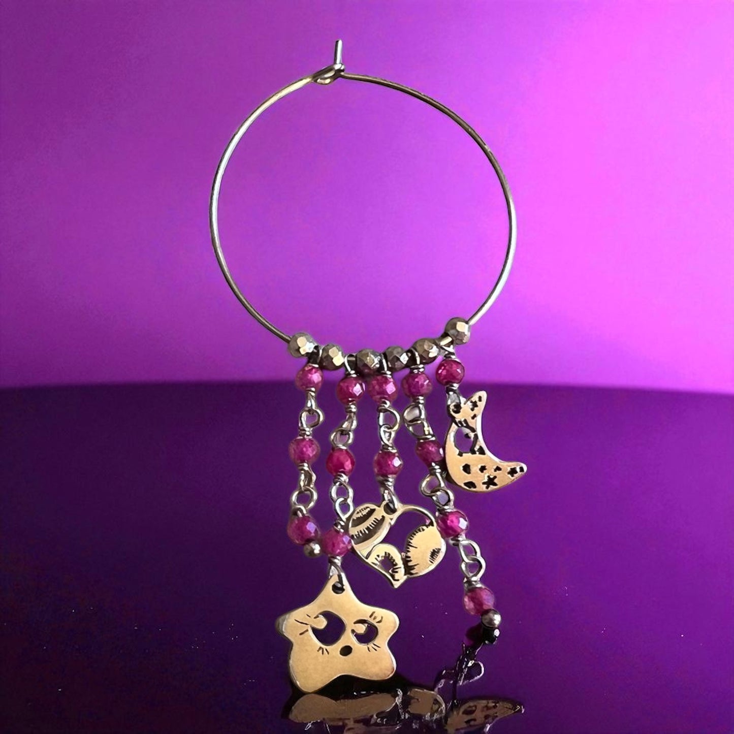 Mono orecchino in acciaio e zirconi