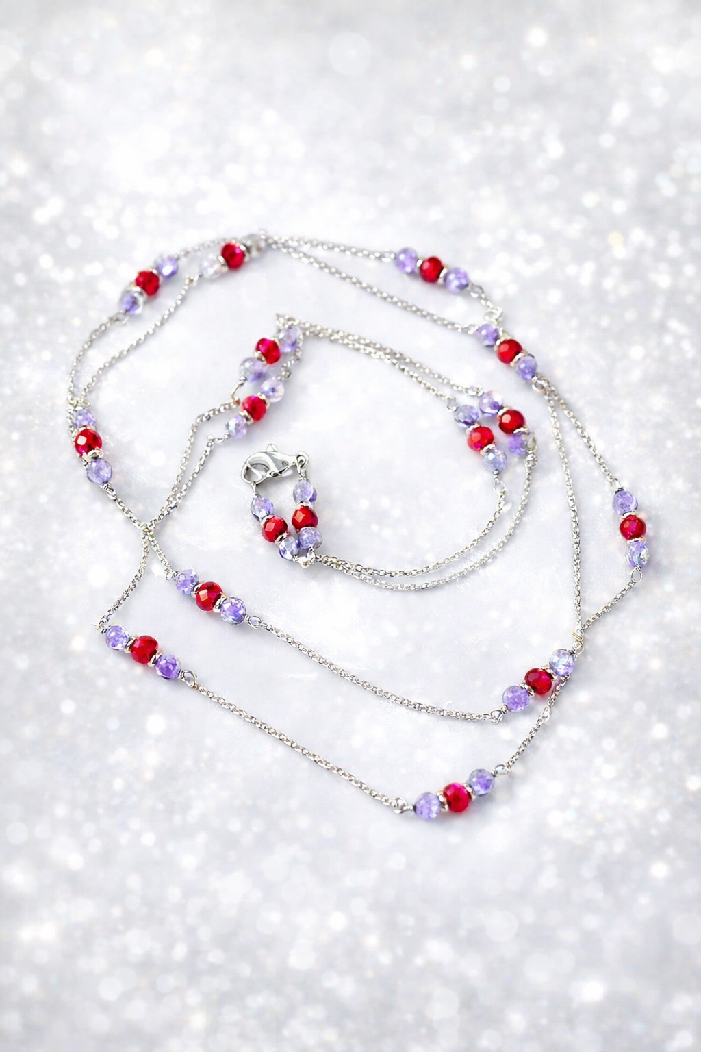 Collana in acciaio diamantato, tanzanite e corindoni rubini firmata Vizio Gioielli