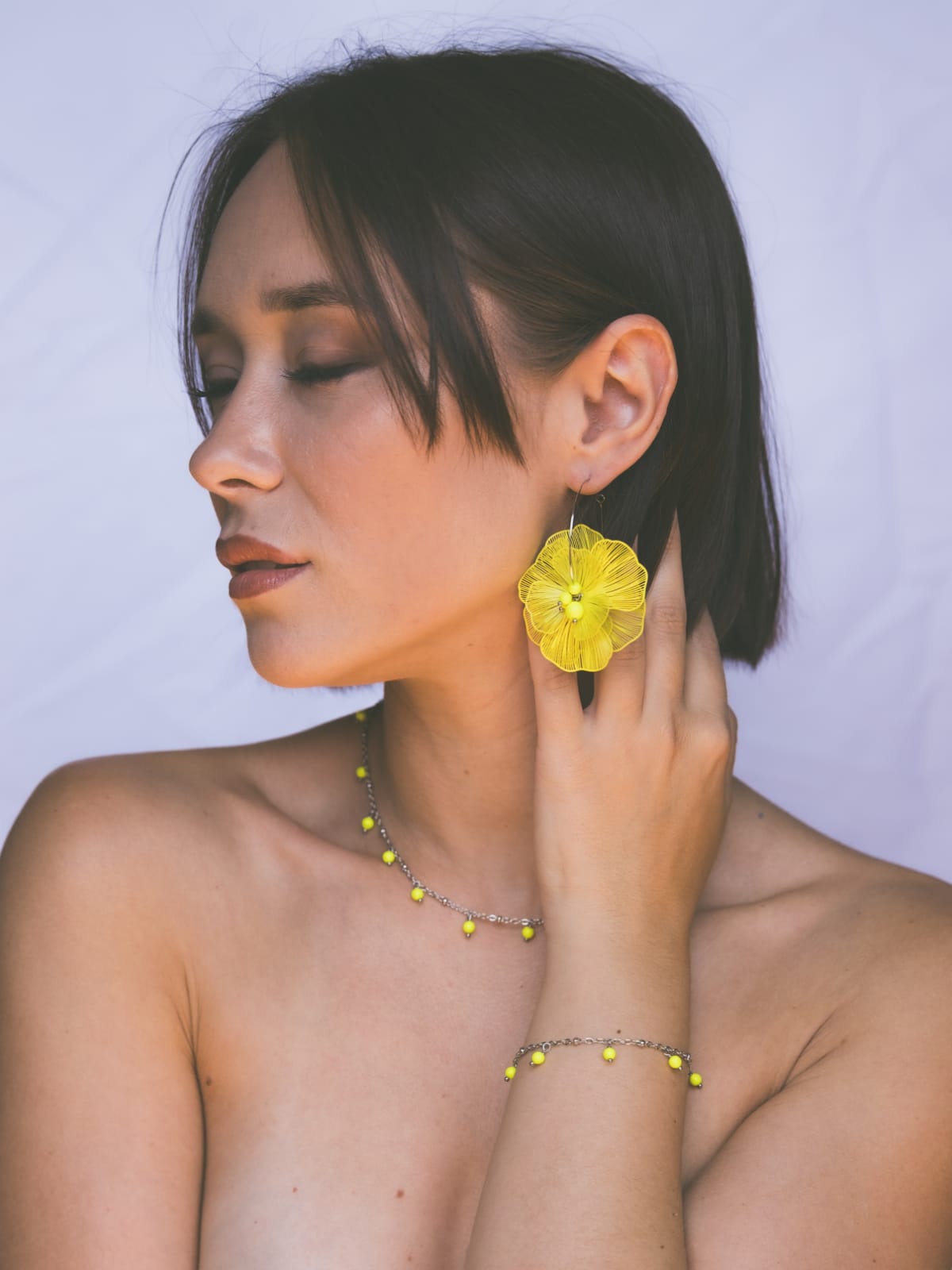 Mono orecchino, girocollo e bracciale  in acciaio e perle Swarovski 