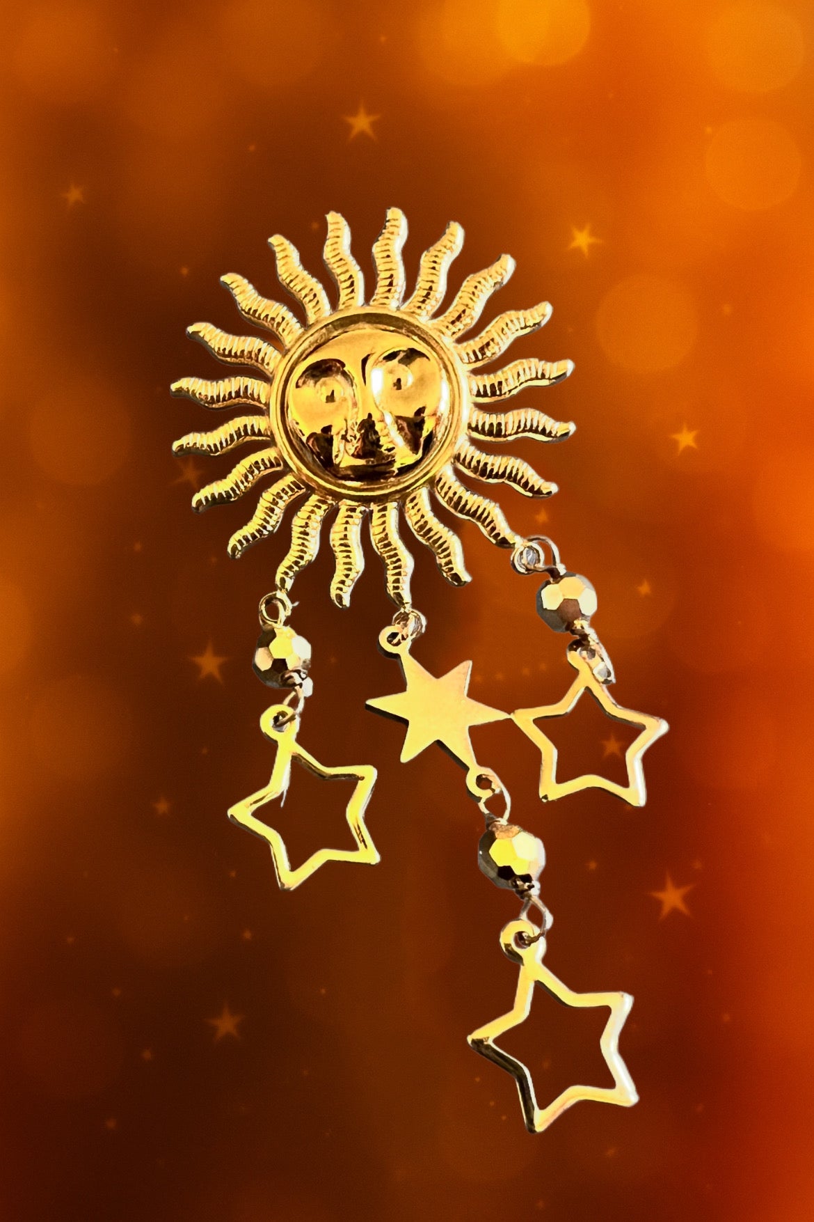 Mono orecchino in acciaio dorato