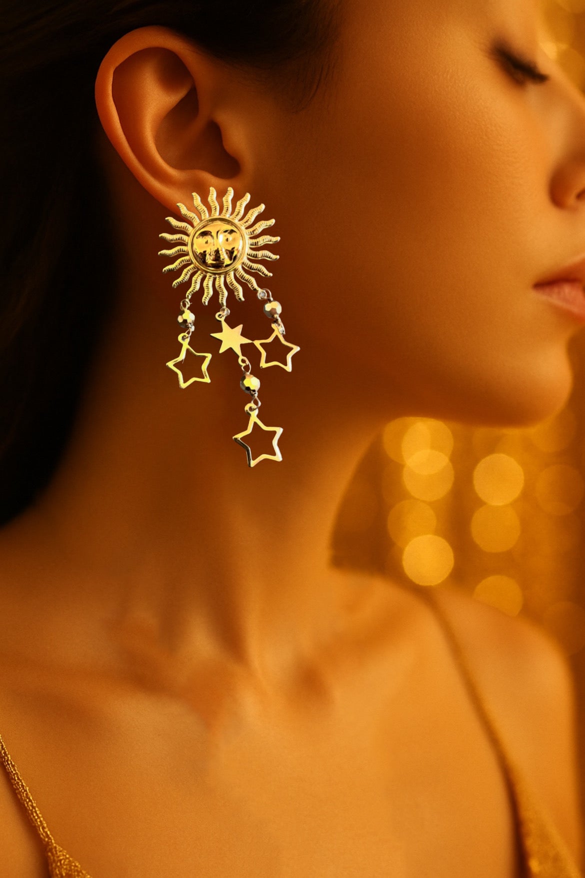 Mono orecchino in acciaio dorato