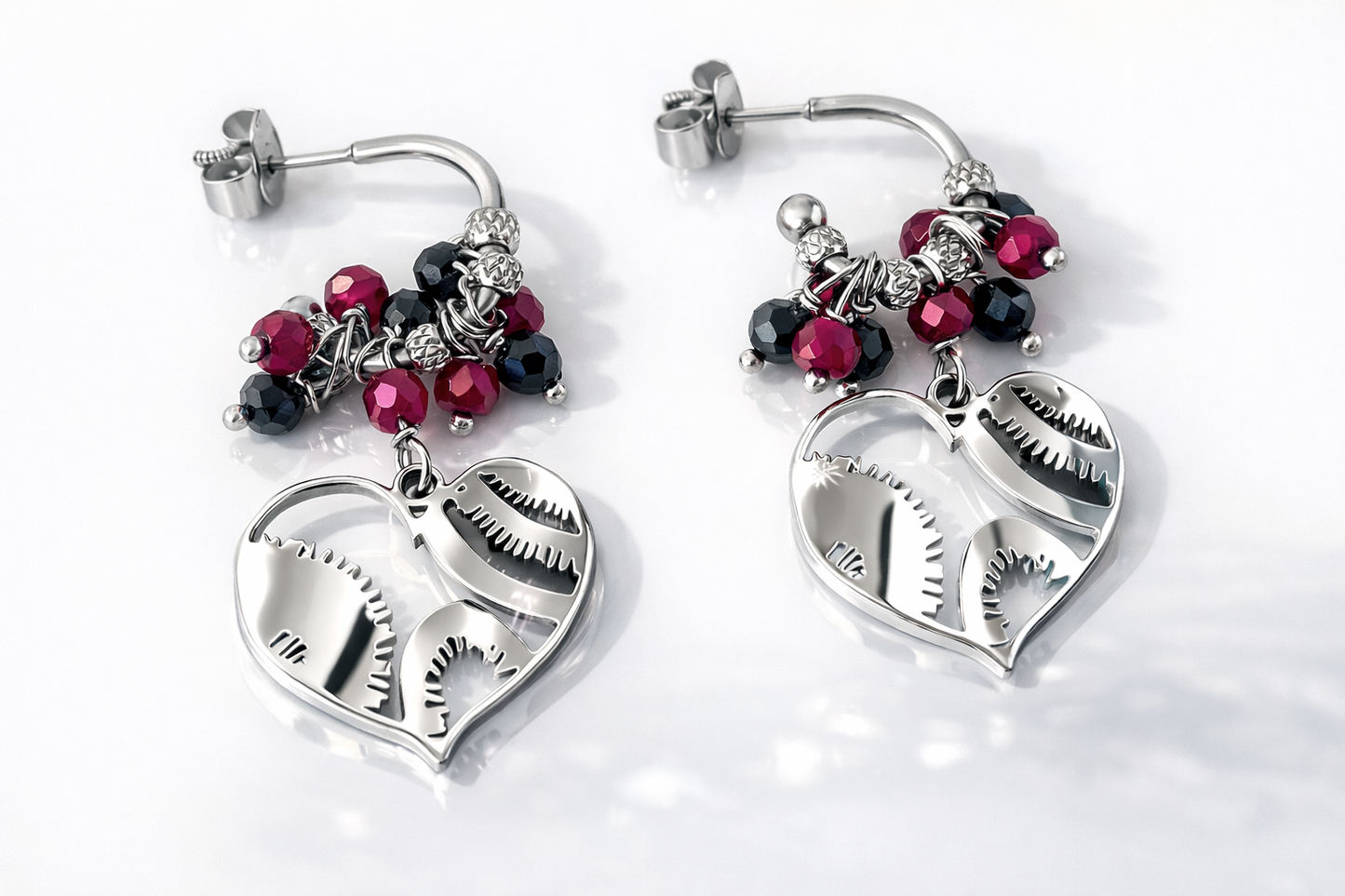 Orecchini in acciaio con farfallina di chiusura, adornati con splendidi spinelli e corindoni rubini firmati Vizio Gioielli