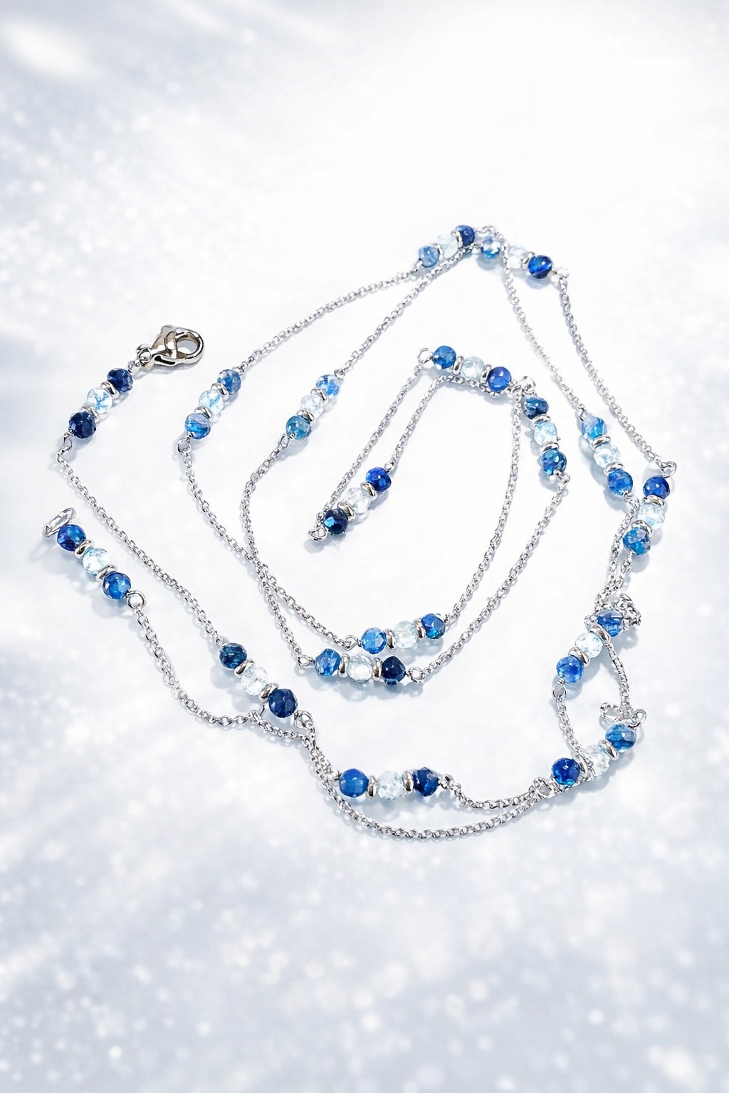 Collana in acciaio diamantato con kyanite e topazi firmata Vizio Gioielli