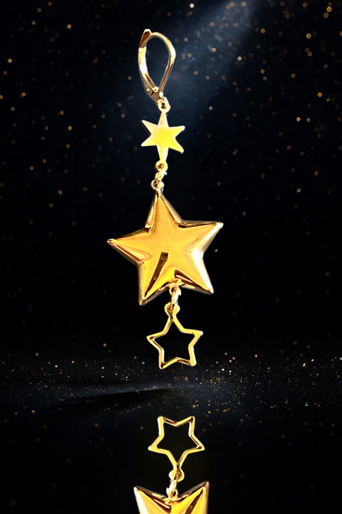 Mono orecchino in acciaio dorato