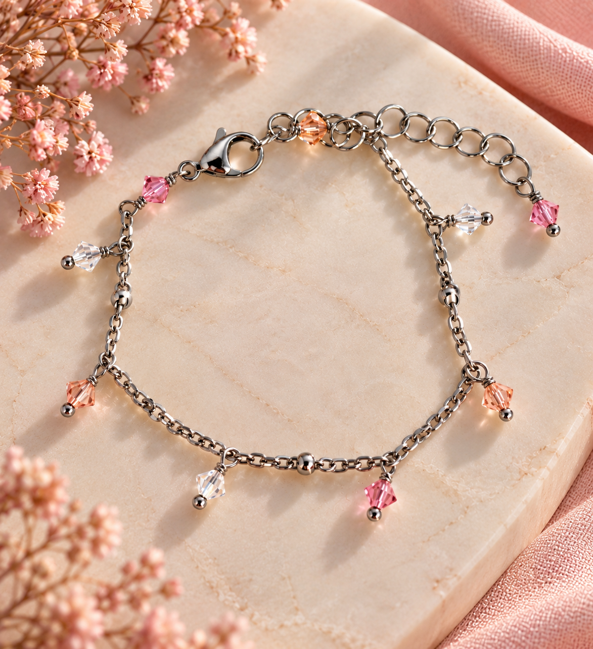 Bracciale California Sunrise in acciaio lucido con cristalli rosa pesca e trasparenti

