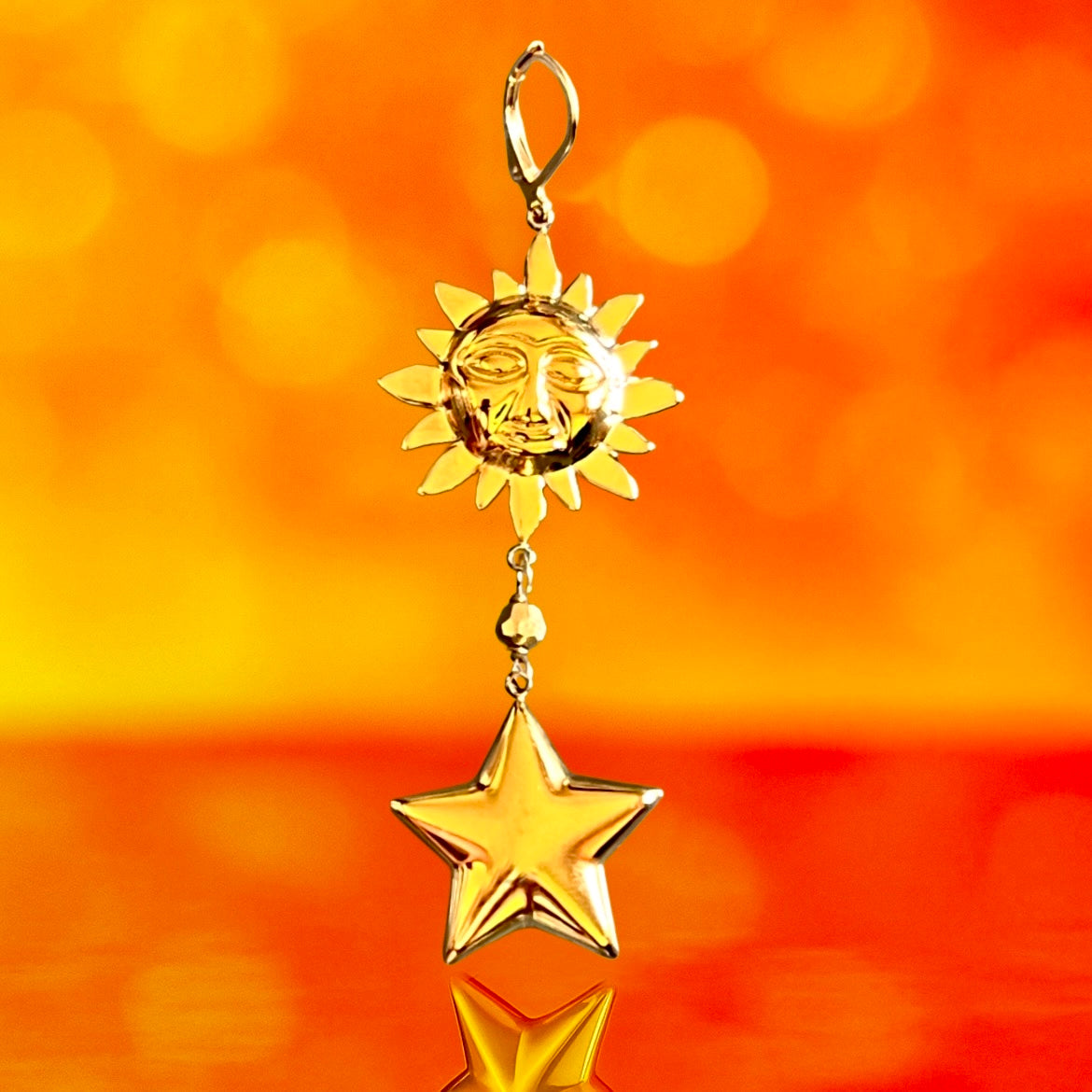 Mono orecchino in acciaio dorato