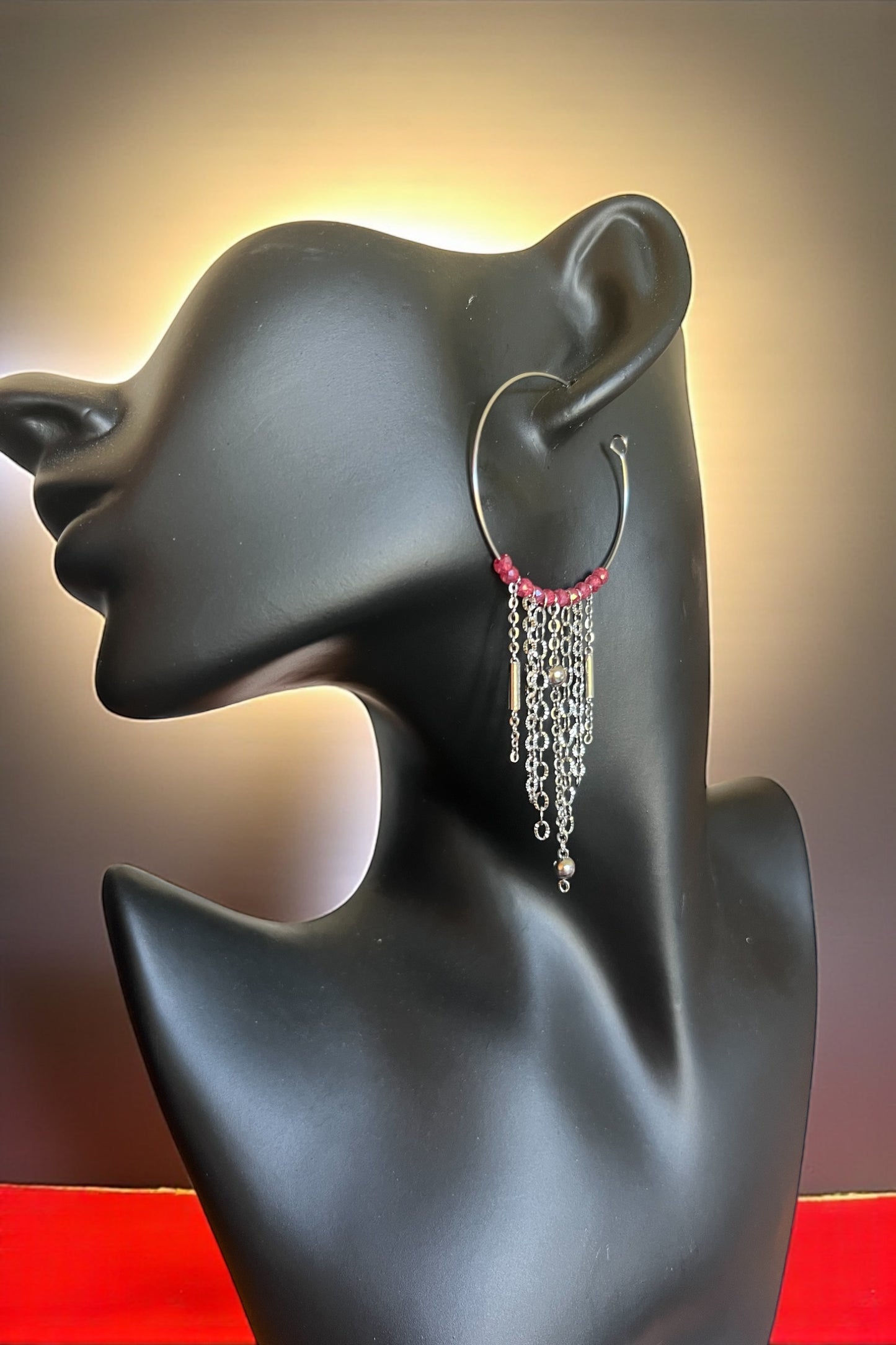 Mono orecchino in acciaio e zirconi 