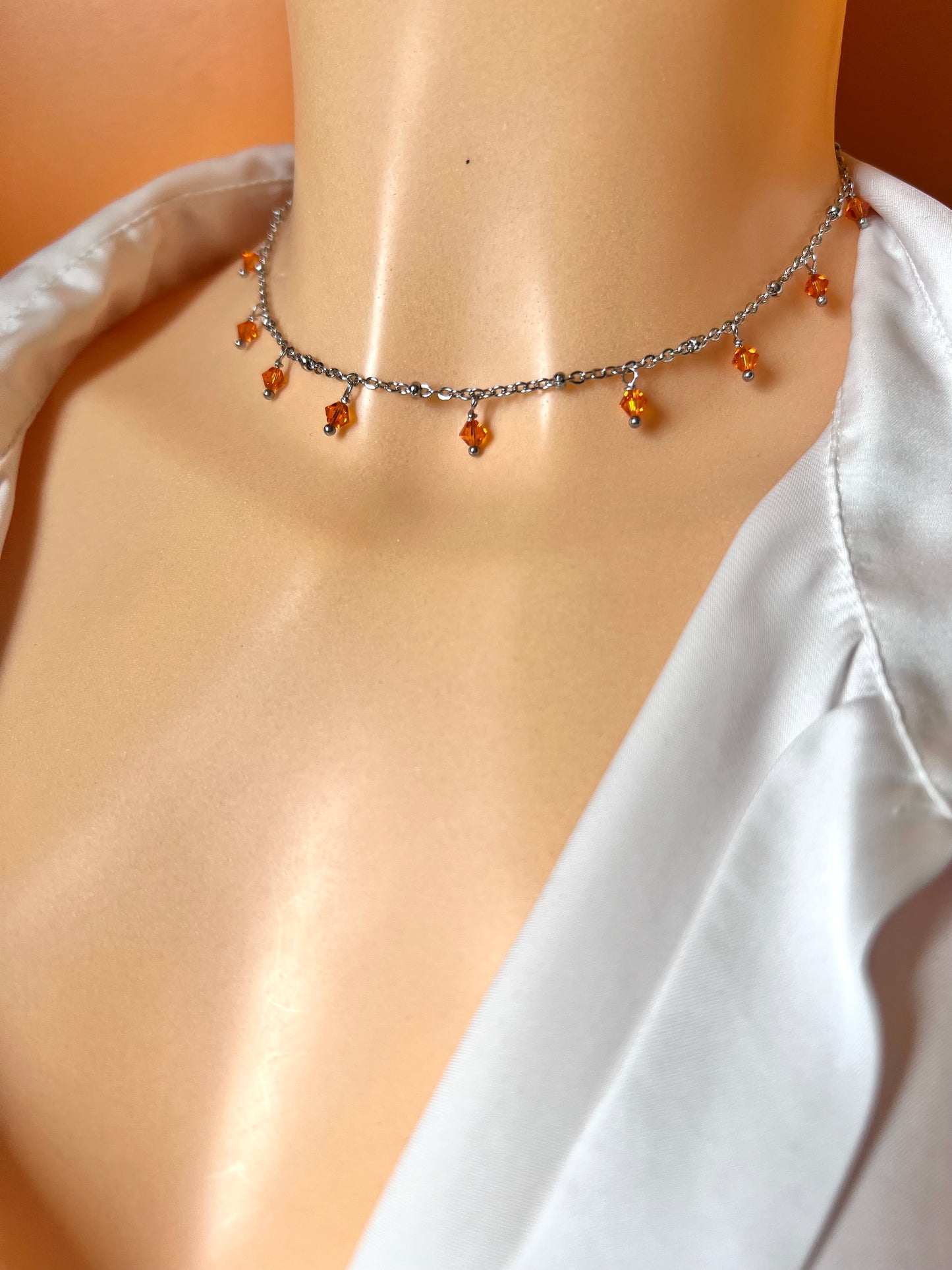 Girocollo in acciaio e cristalli Swarovski arancioni