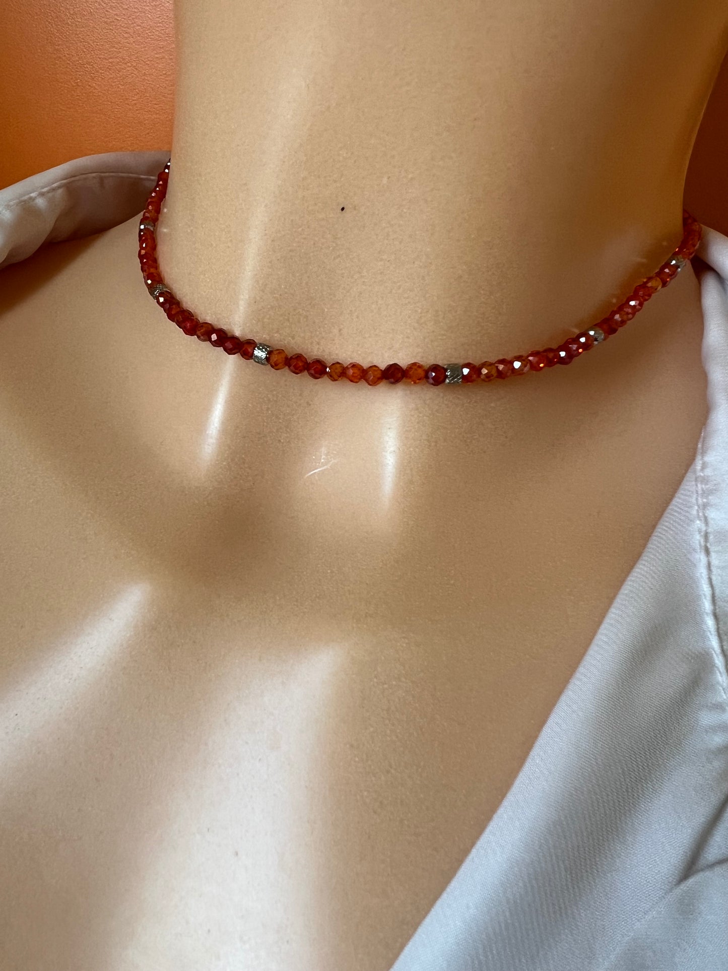 Girocollo in acciaio e zirconi arancioni