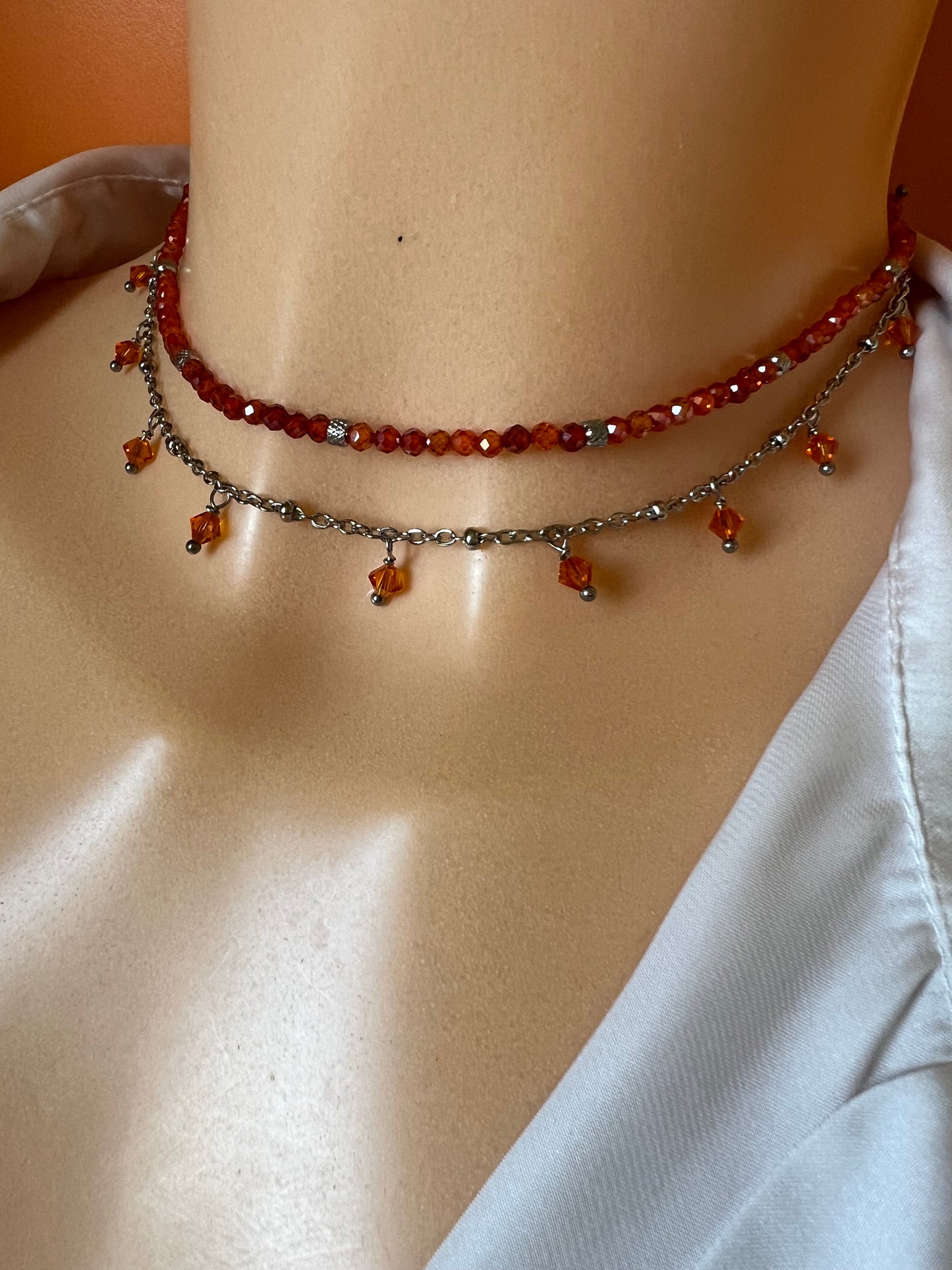 Girocollo in acciaio e zirconi arancioni