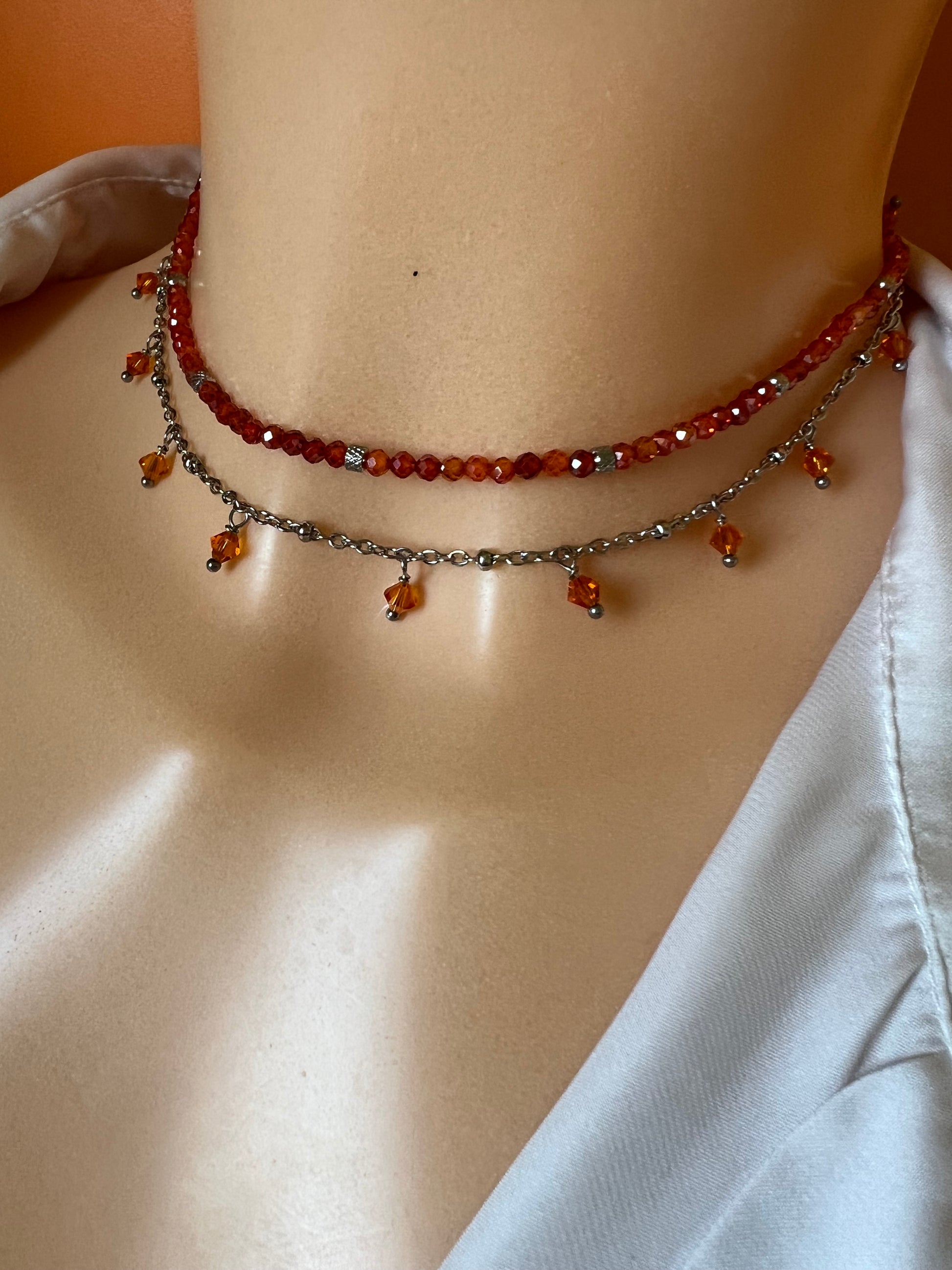 Girocollo in acciaio e zirconi arancioni