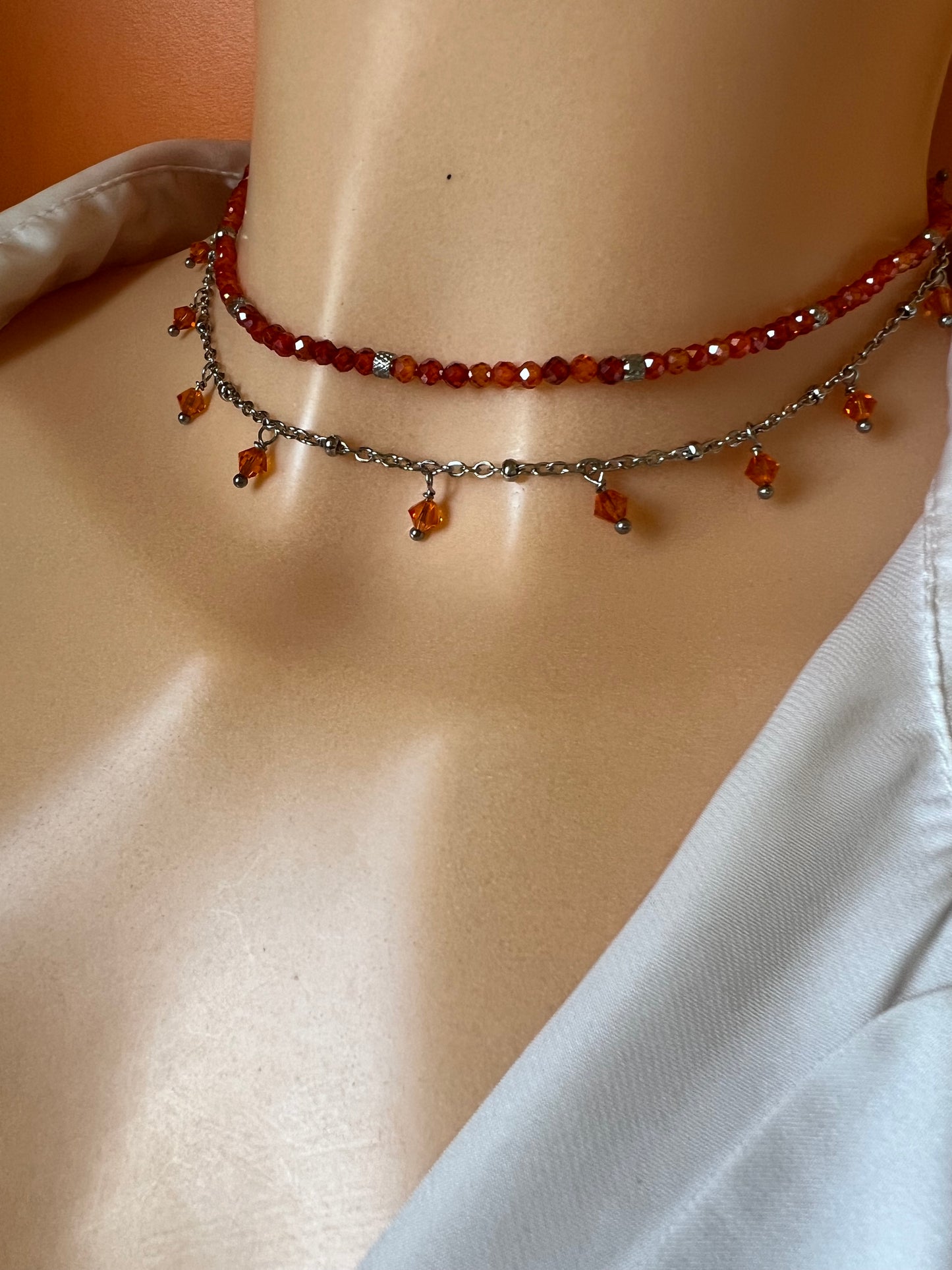 Girocollo in acciaio e zirconi arancioni