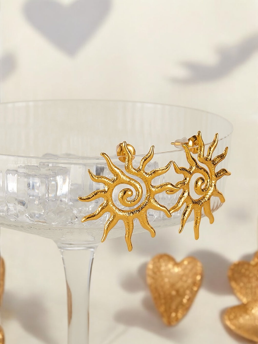 Orecchini  in acciaio dorato Sole