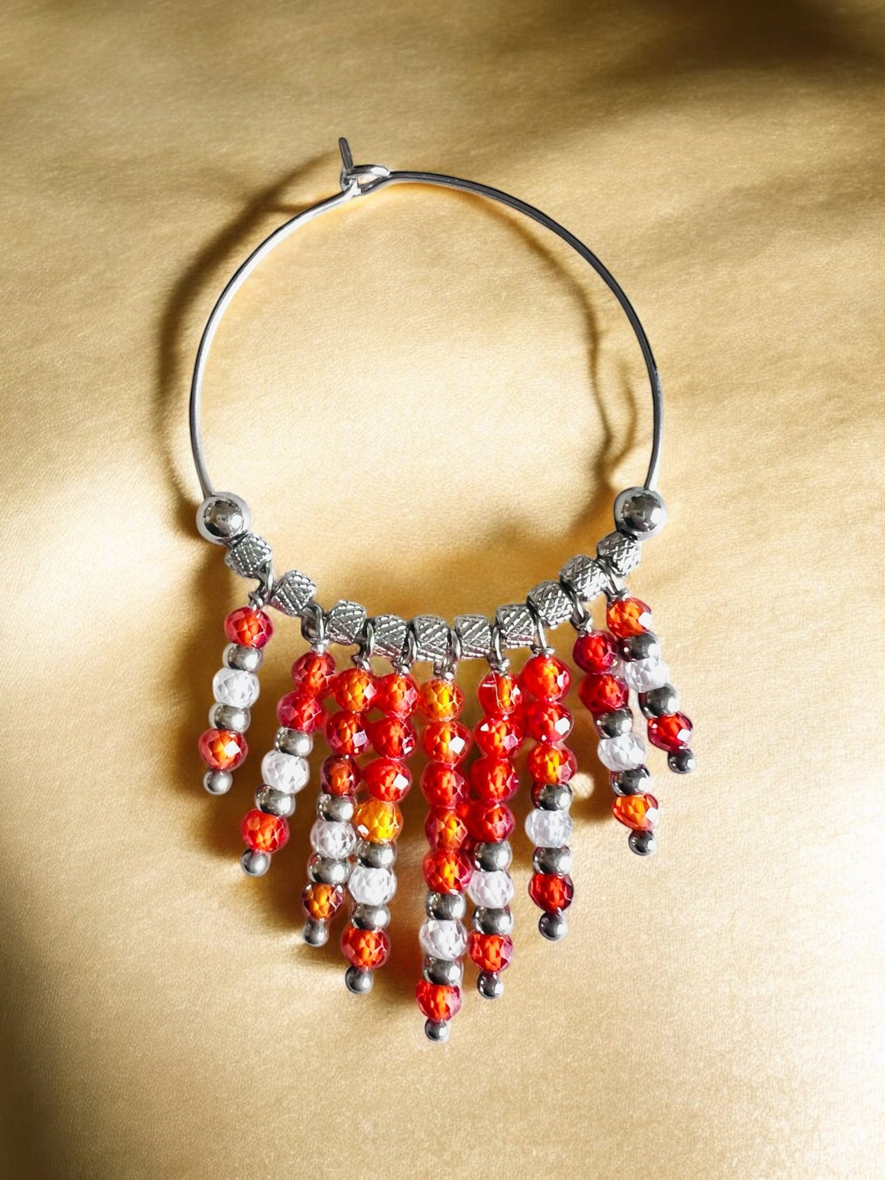 Mono orecchino in acciaio e zirconi