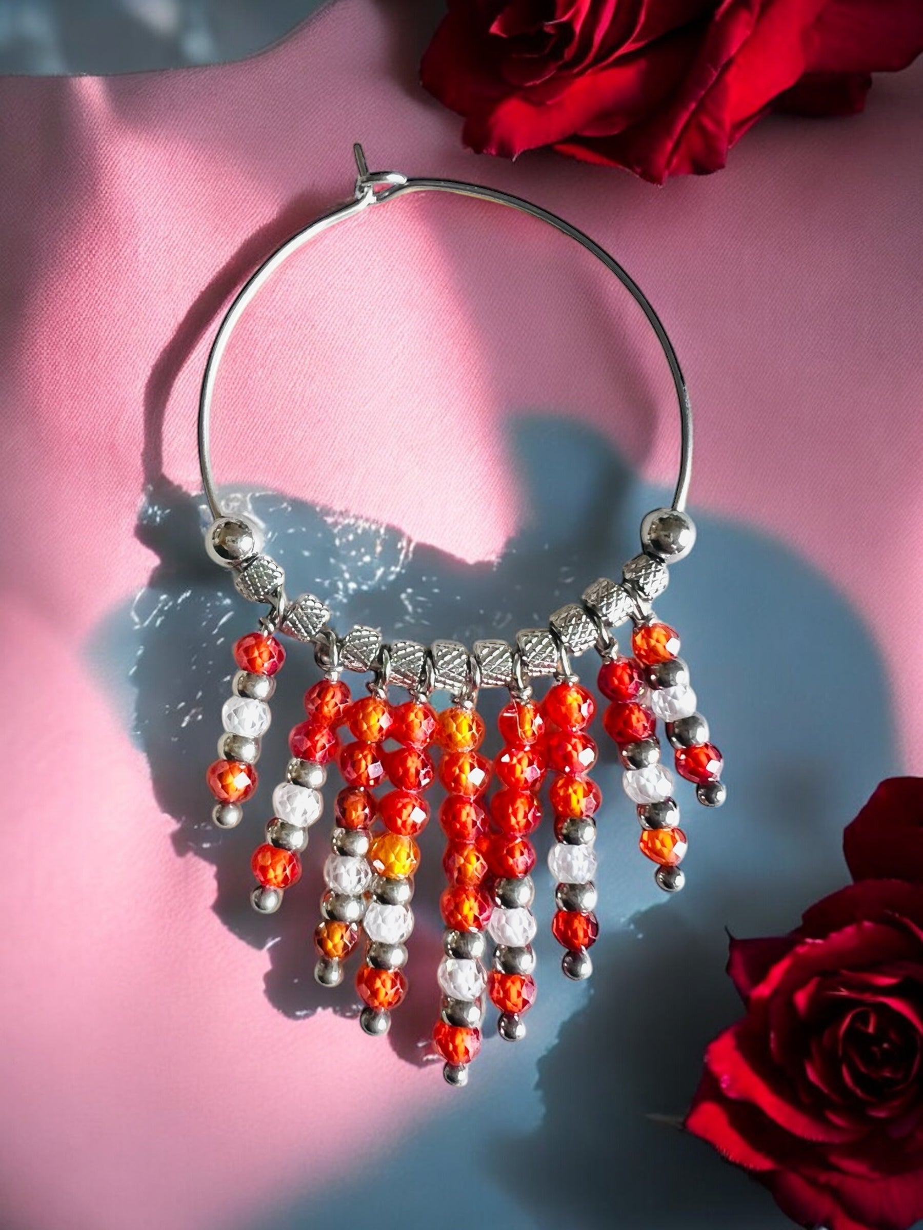 Mono orecchino in acciaio e zirconi