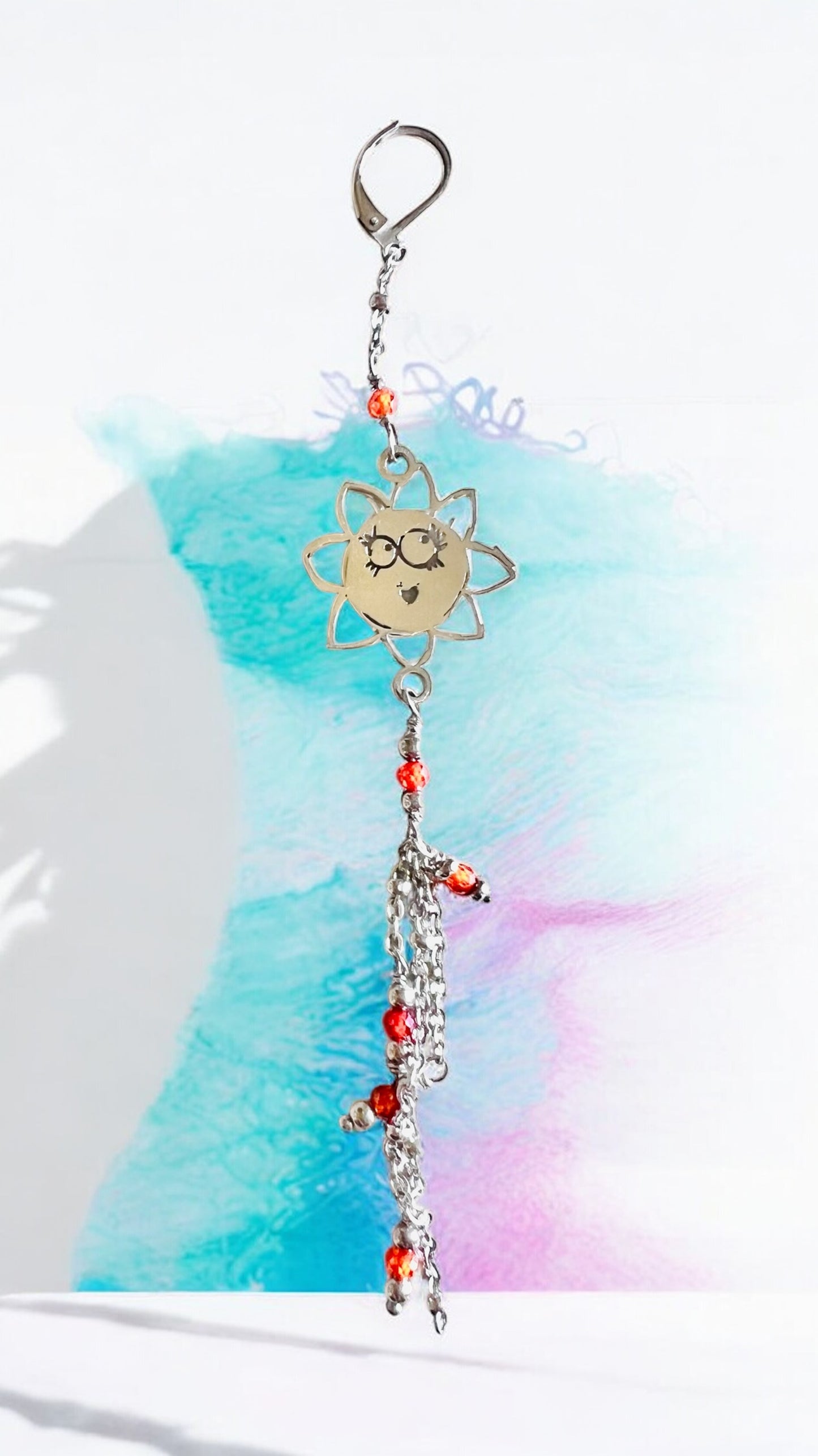 Mono orecchino in acciaio e zirconi arancioni