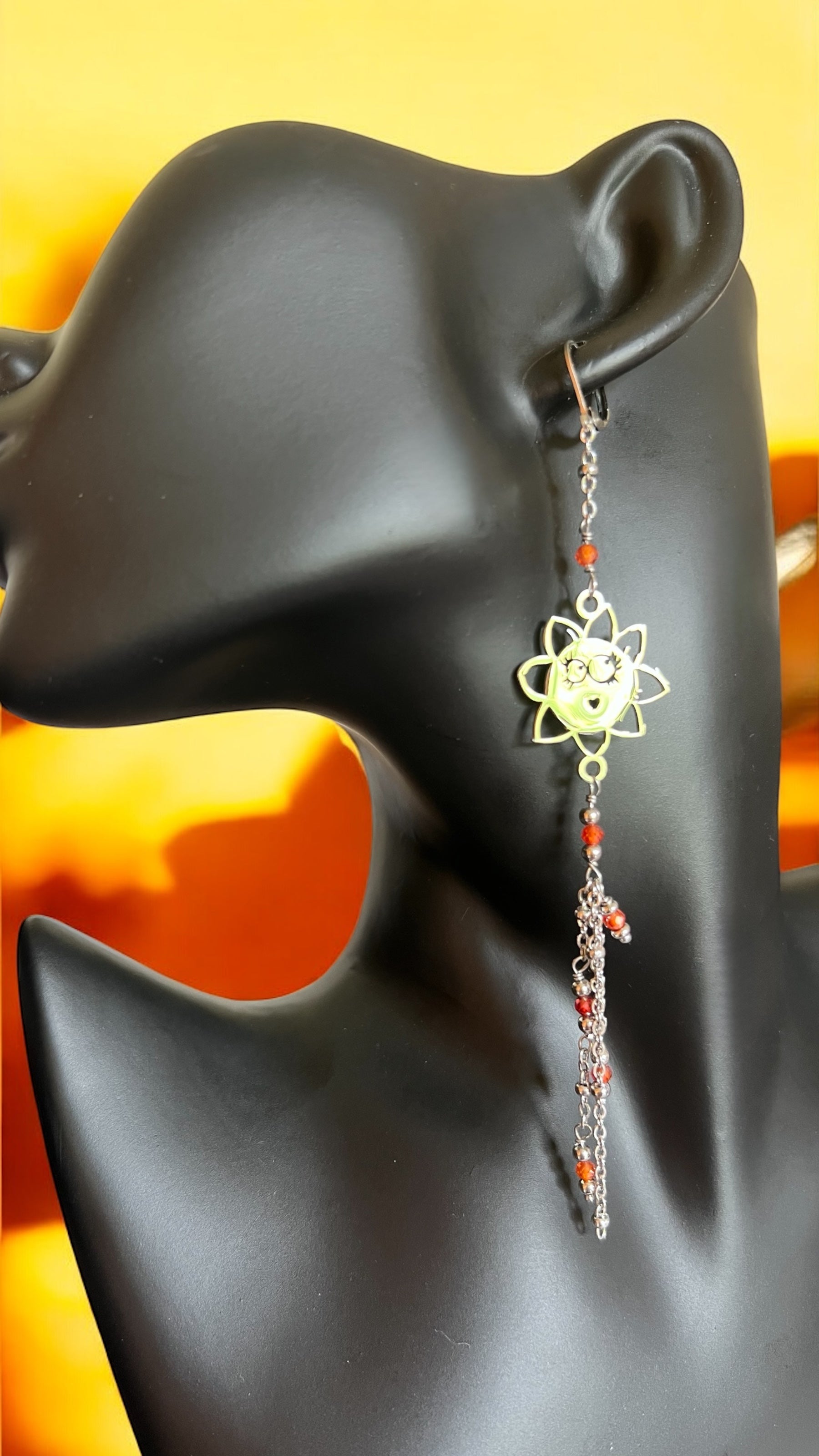 Mono orecchino in acciaio e zirconi arancioni