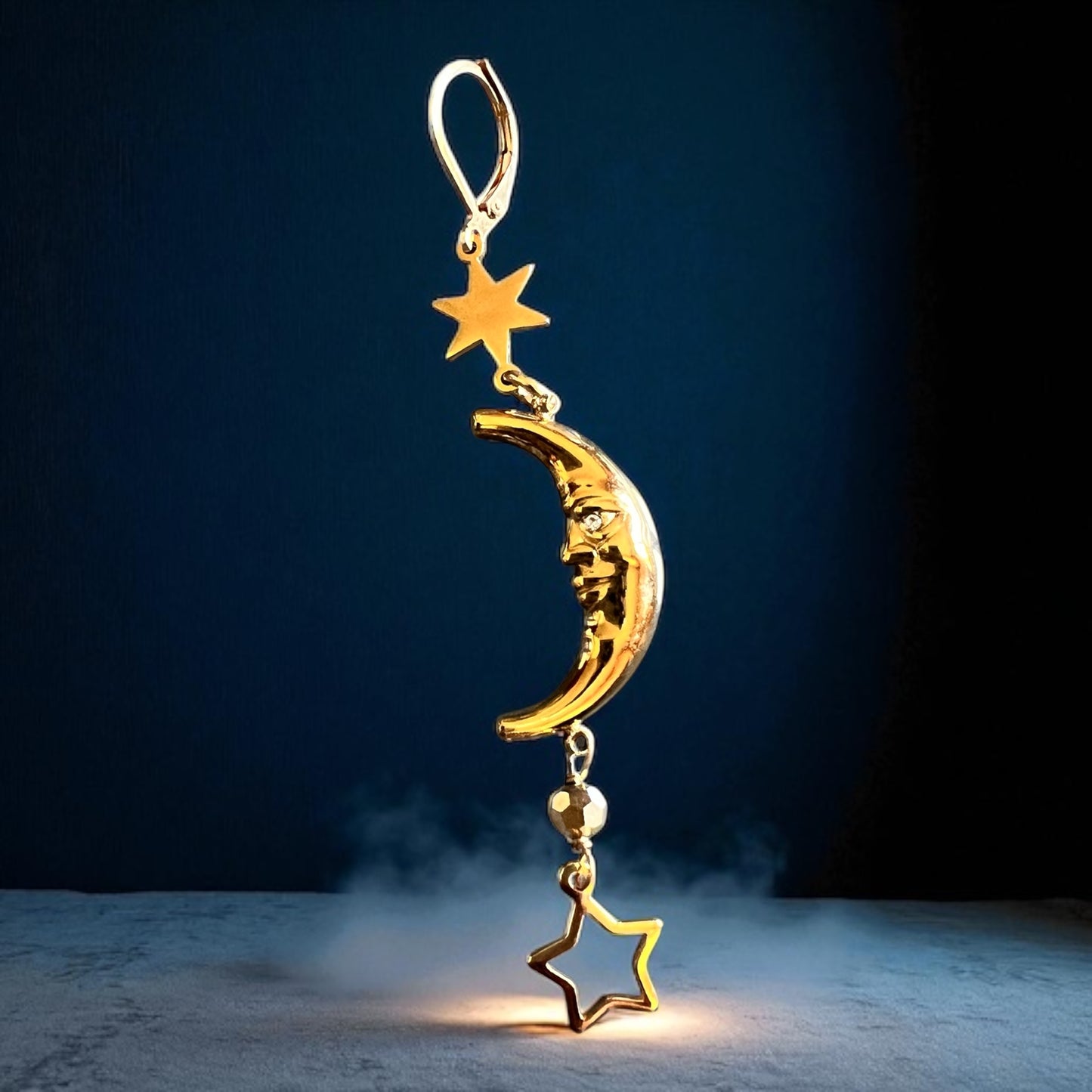 Mono orecchino in acciaio dorato