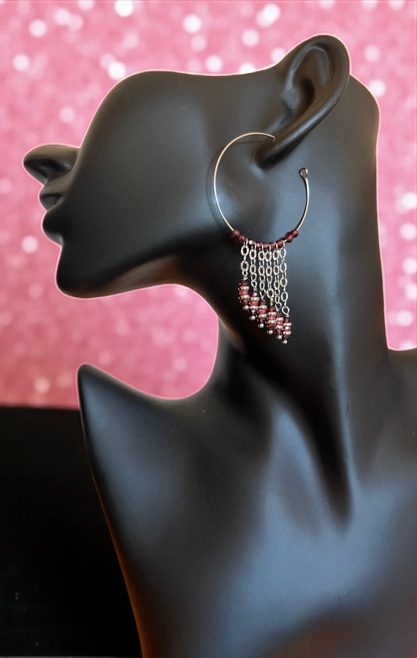 Mono orecchino in acciaio, zirconi e granate