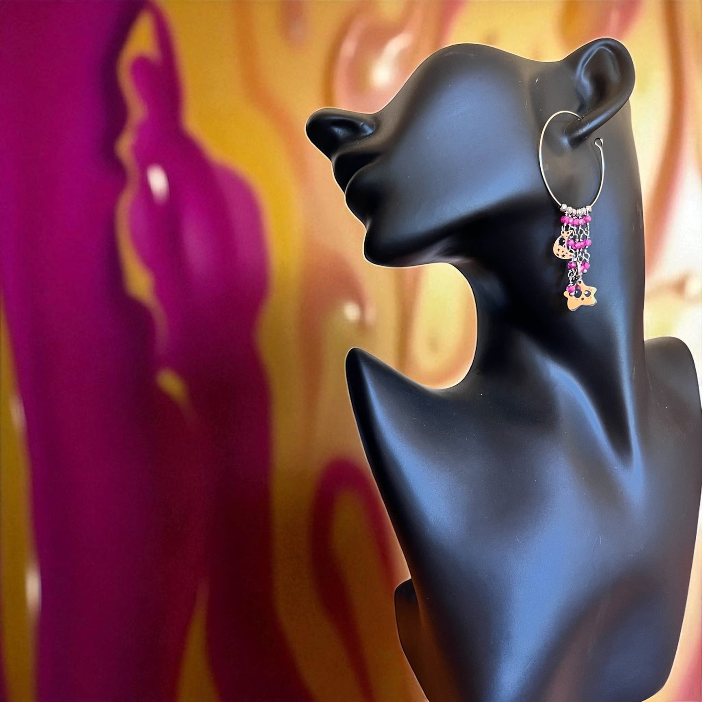 Mono orecchino in acciaio e zirconi