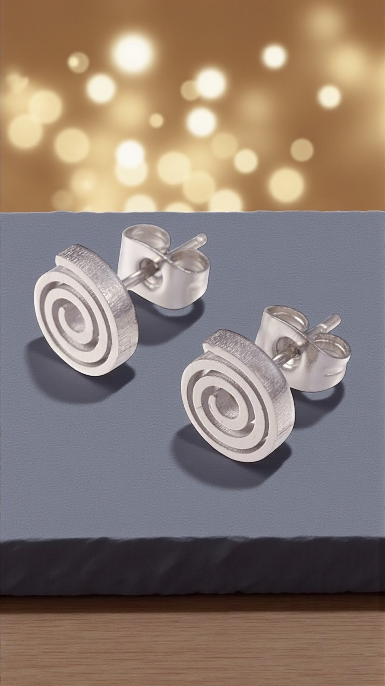 Orecchini a lobo in acciaio a spirale