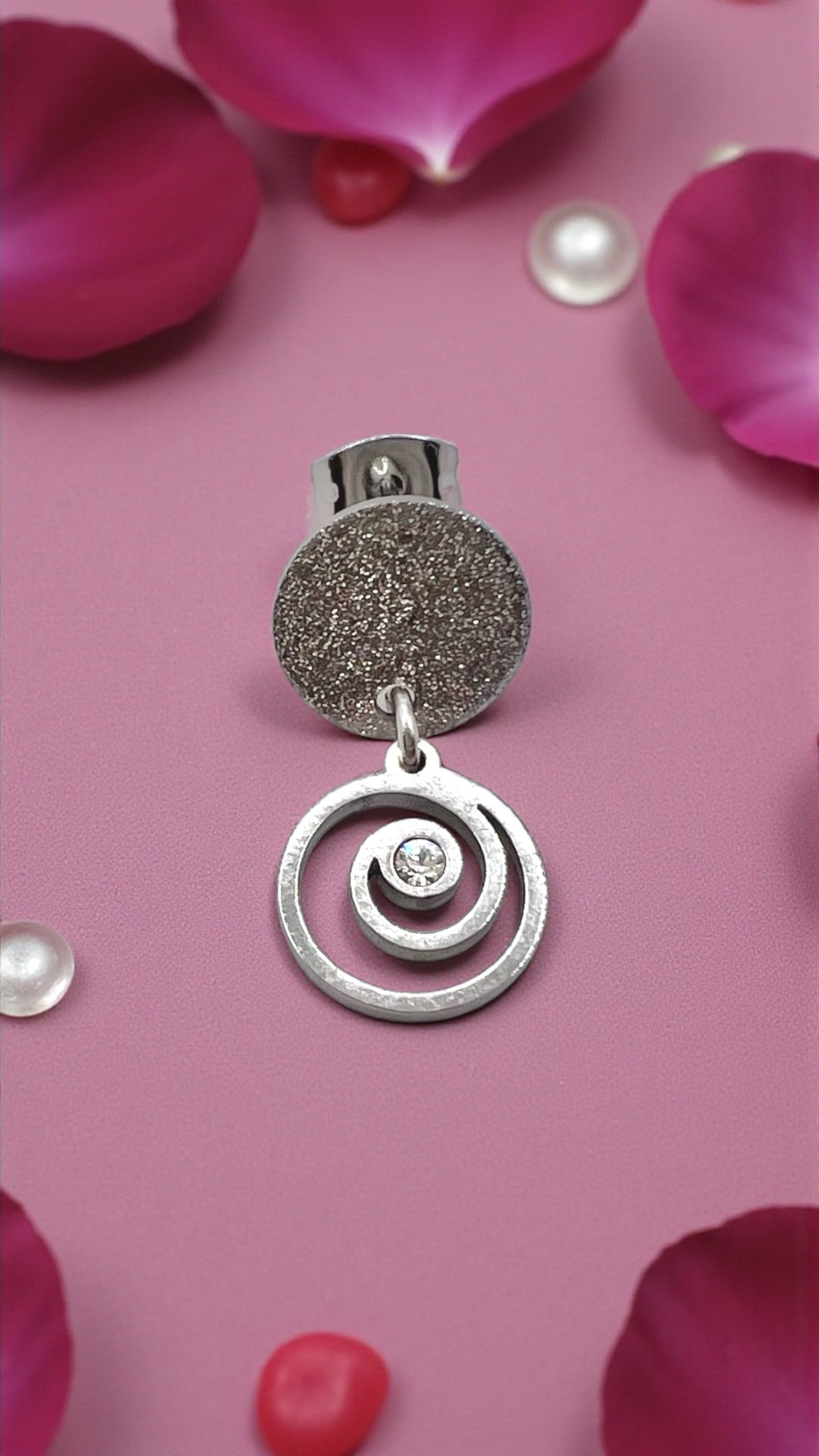 Mono orecchino Vortice in acciaio e zircone