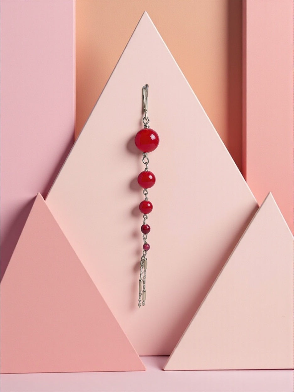 Mono orecchino in acciaio e rubini lab  