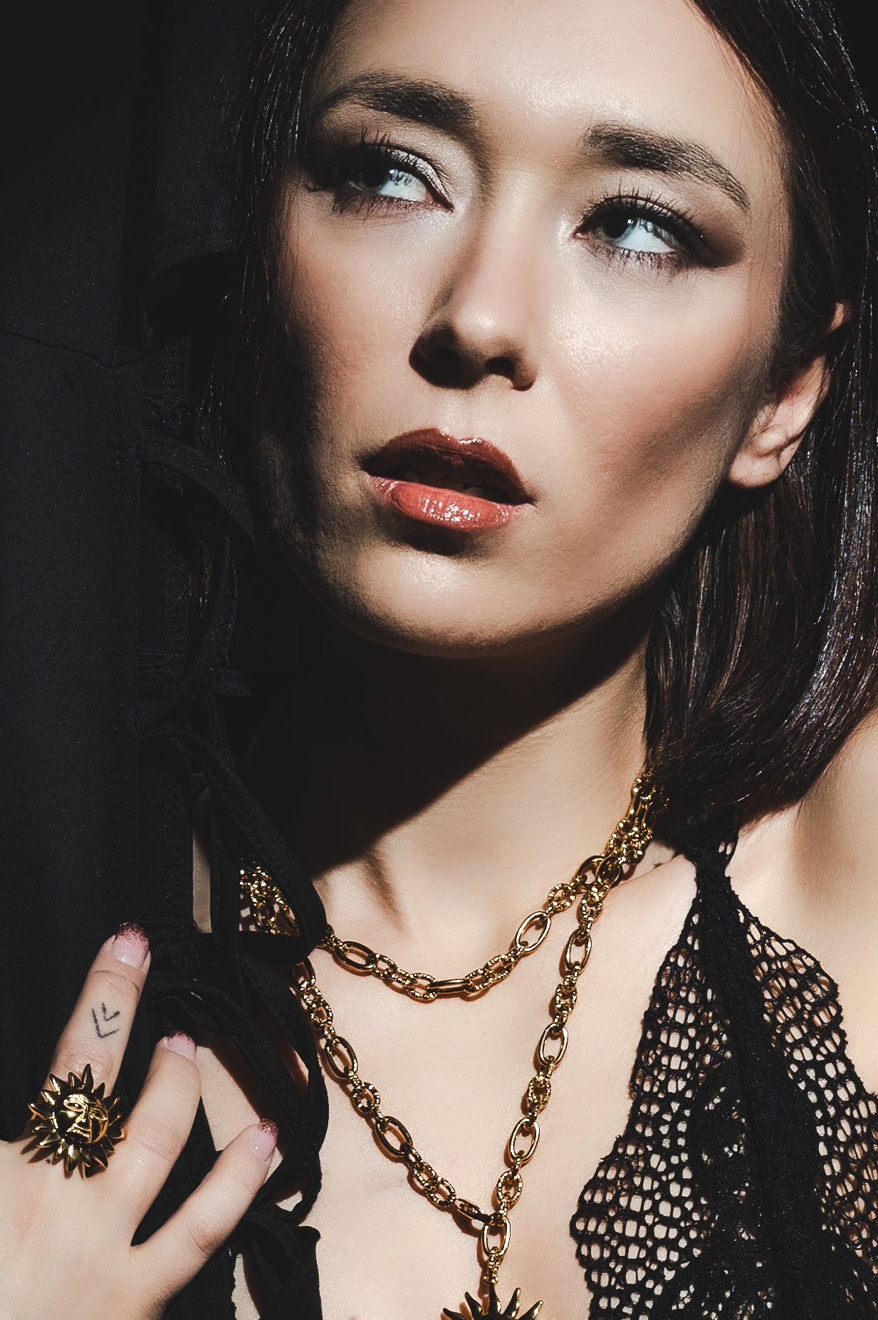 Collana e anello in acciaio dorato Sole