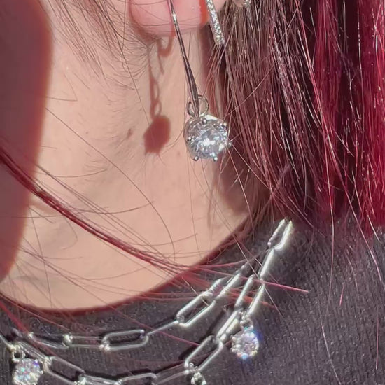 Girocollo e orecchini in acciaio e Moissanite 